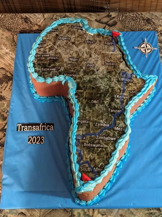 Africa shaped novelty cake with a map and terrain design