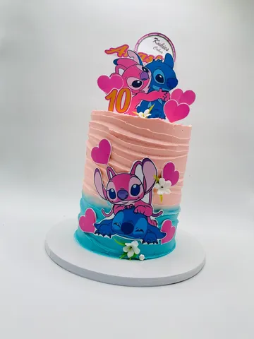 Pink to blue Angel and Stitch themed cake with hearts and blossoms