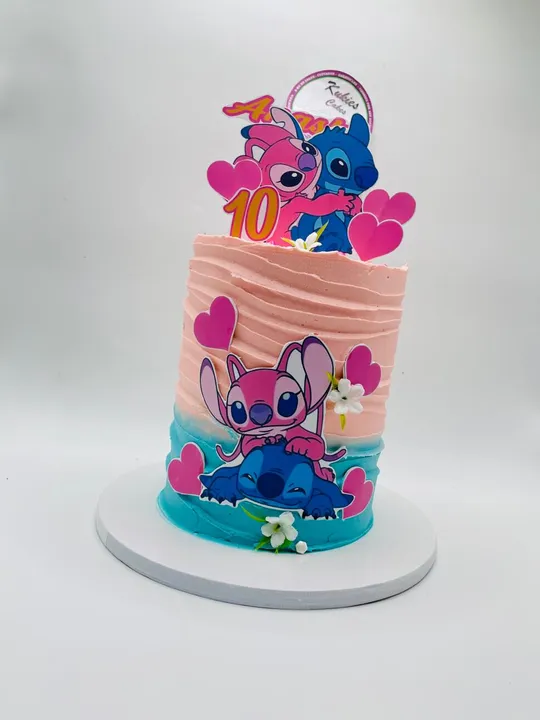 Pink to blue Angel and Stitch themed cake with hearts and blossoms