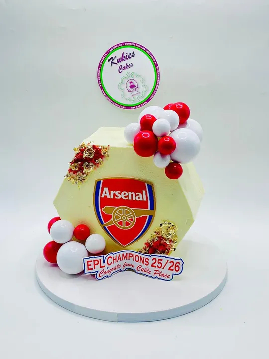 Hexagonal cake with an Arsenal FC crest celebrating an EPL Champions win