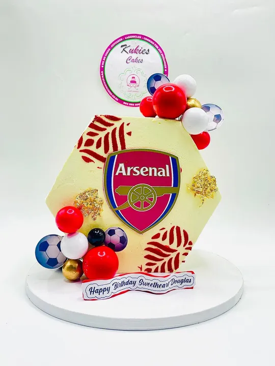 Hexagonal cake with a red leaf print and Arsenal FC crest