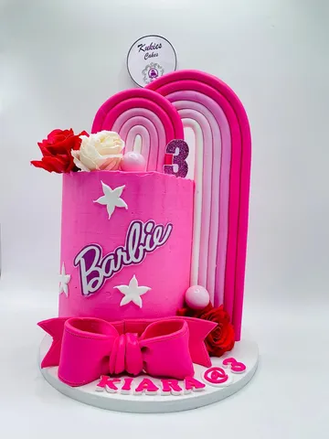 Hot pink Barbie themed cake with rainbow fondant arches