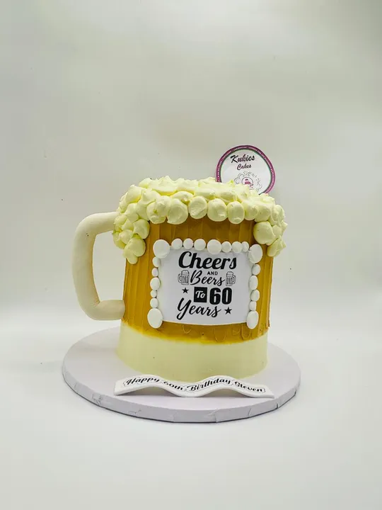Beer mug shaped novelty cake with a cream foam top for a 60th birthday