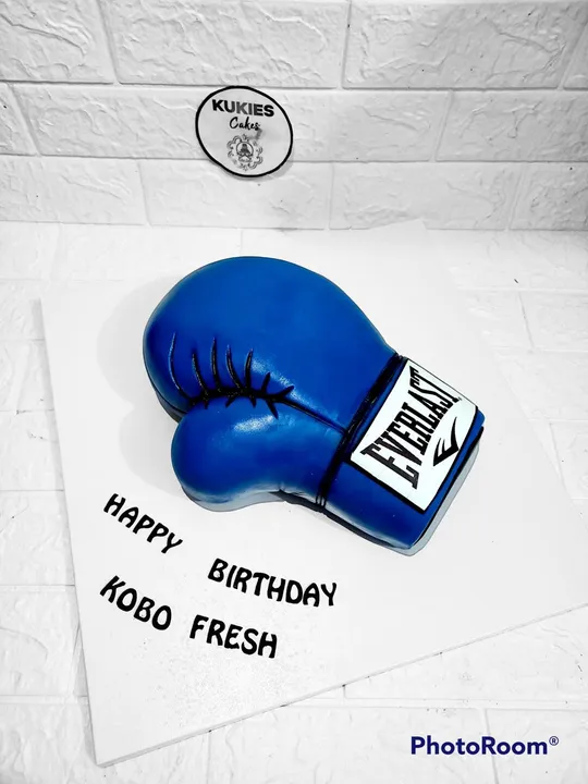 Blue boxing glove shaped novelty birthday cake
