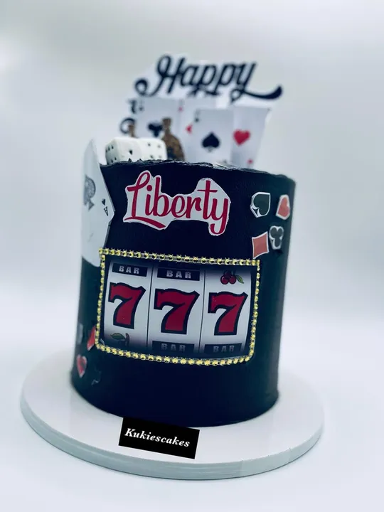 Black casino themed birthday cake with playing cards and dice print