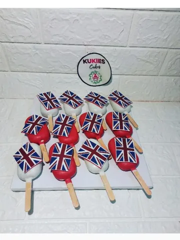 Red and white cakesicles with England flag toppers on sticks