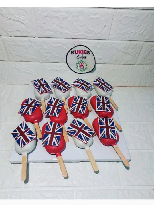 Red and white cakesicles with England flag toppers on sticks