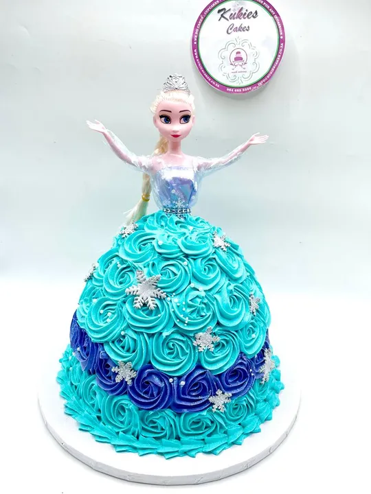 Frozen Elsa doll cake with a teal and blue rosette skirt