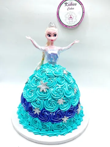 Frozen Elsa doll cake with a teal and blue rosette skirt