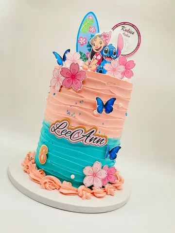 Peach to teal Lilo and Stitch themed cake with cherry blossoms and butterflies