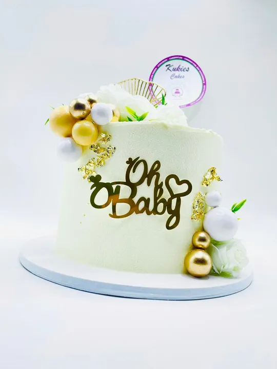 Pale cream Oh Baby cake with white roses and gold leaf