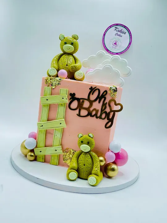 Peach square baby shower cake with fondant teddy bears and a wood fence