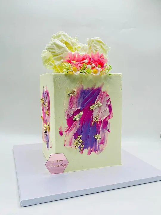 Pale cake with a hand-painted pink and purple marble texture