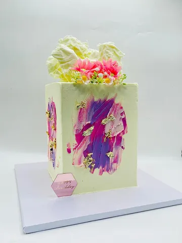 Pale cake with a hand-painted pink and purple marble texture