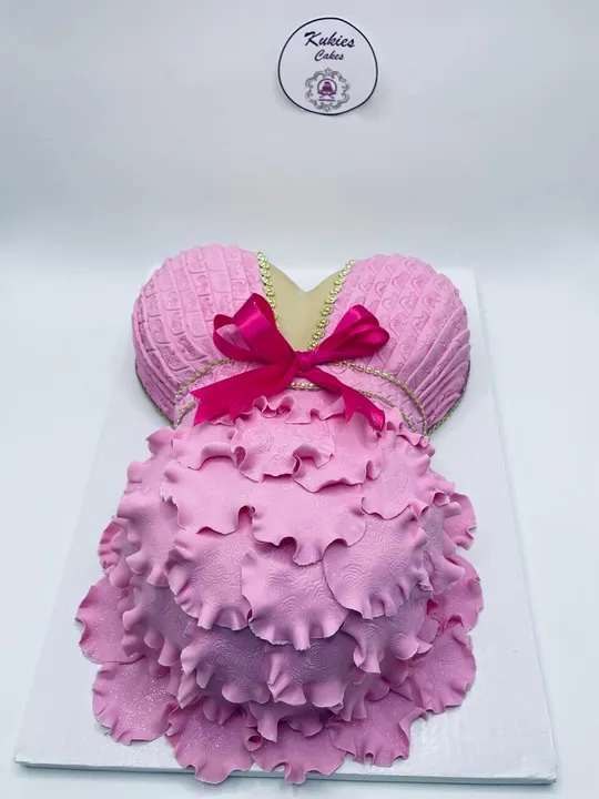 Pink ruffled fondant novelty cake in a tutu shape