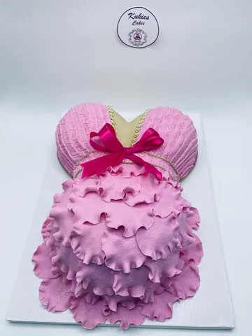 Pink ruffled fondant novelty cake in a tutu shape