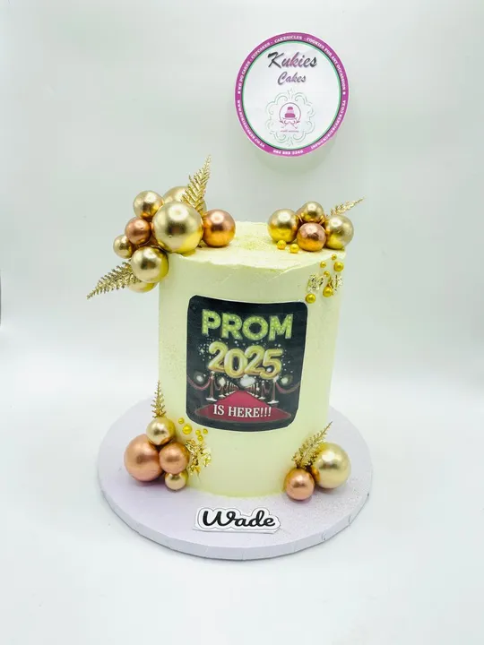 Pale cake with gold sphere clusters and a Prom 2025 print