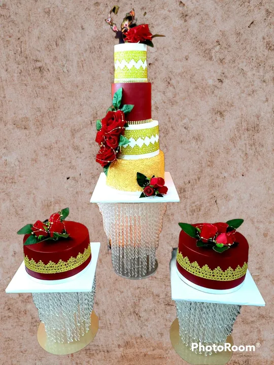 Burgundy and gold 4-tier wedding cake with matching minis and red roses