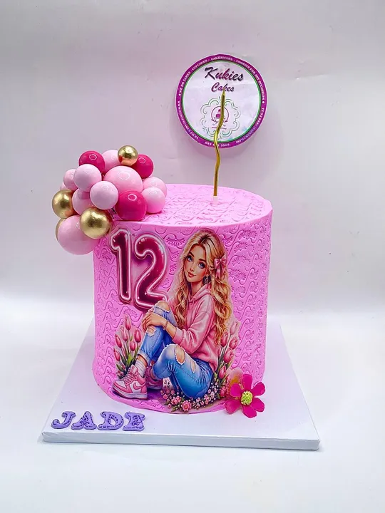 Pink textured cake with a printed teen fashion illustration