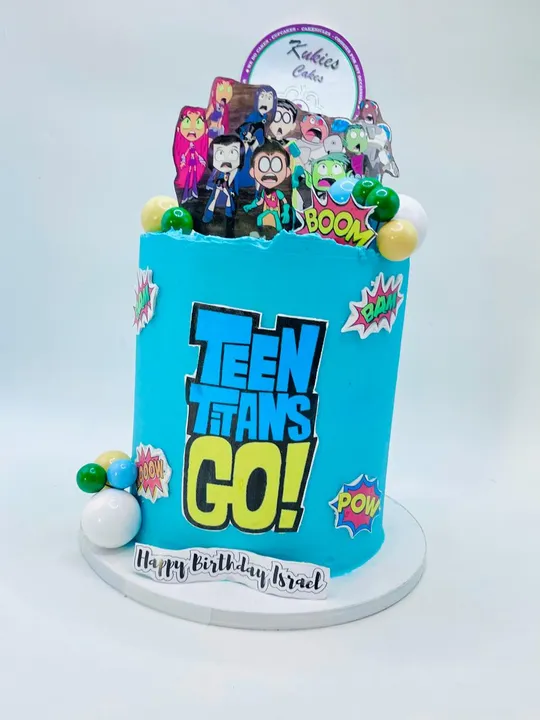Teal Teen Titans Go themed birthday cake with comic style stickers