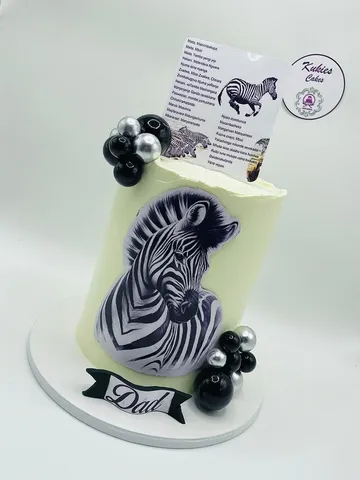 Pale green zebra print cake with black and silver spheres for a Dad celebration